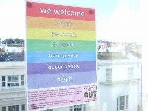 a poster welcoming LGBTQ people