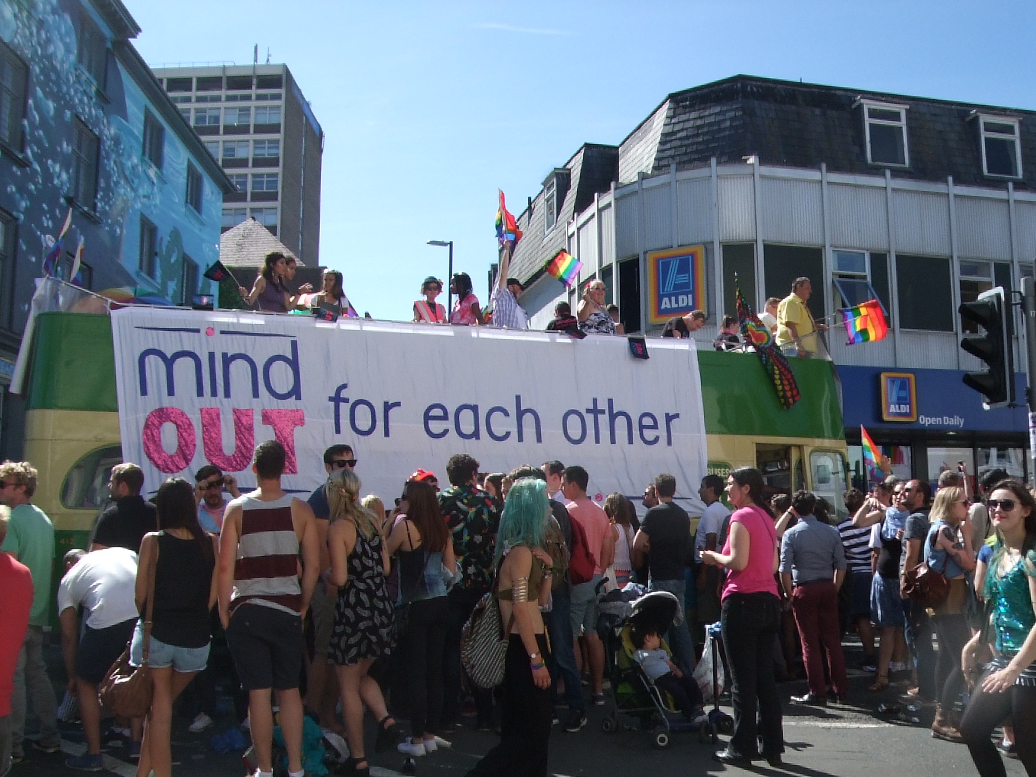 birghton pride bus in 2015 surrounded by people