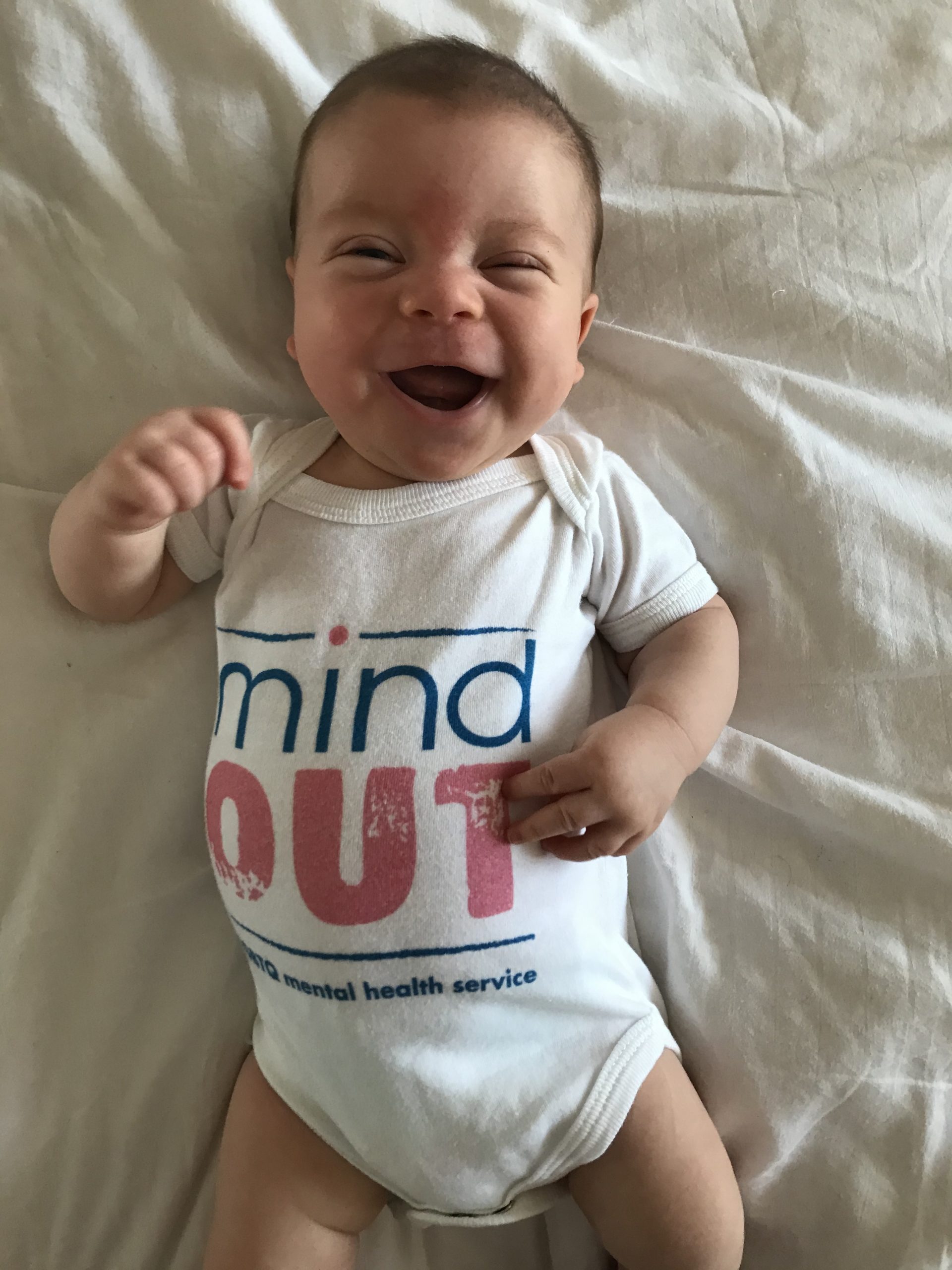 baby luca laughing adorably in his mindout onesie