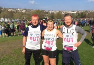 three runners standing proudly in their mindout branded marathon vests