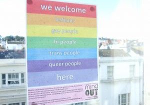 a poster welcoming LGBTQ people