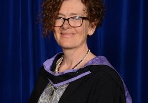 close up of helen jones, director of MindOut, in graduation gown