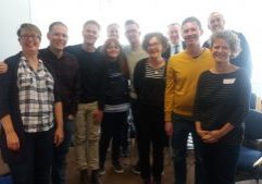 MindOut staff and trustees standing with Llods bank rainbow network members